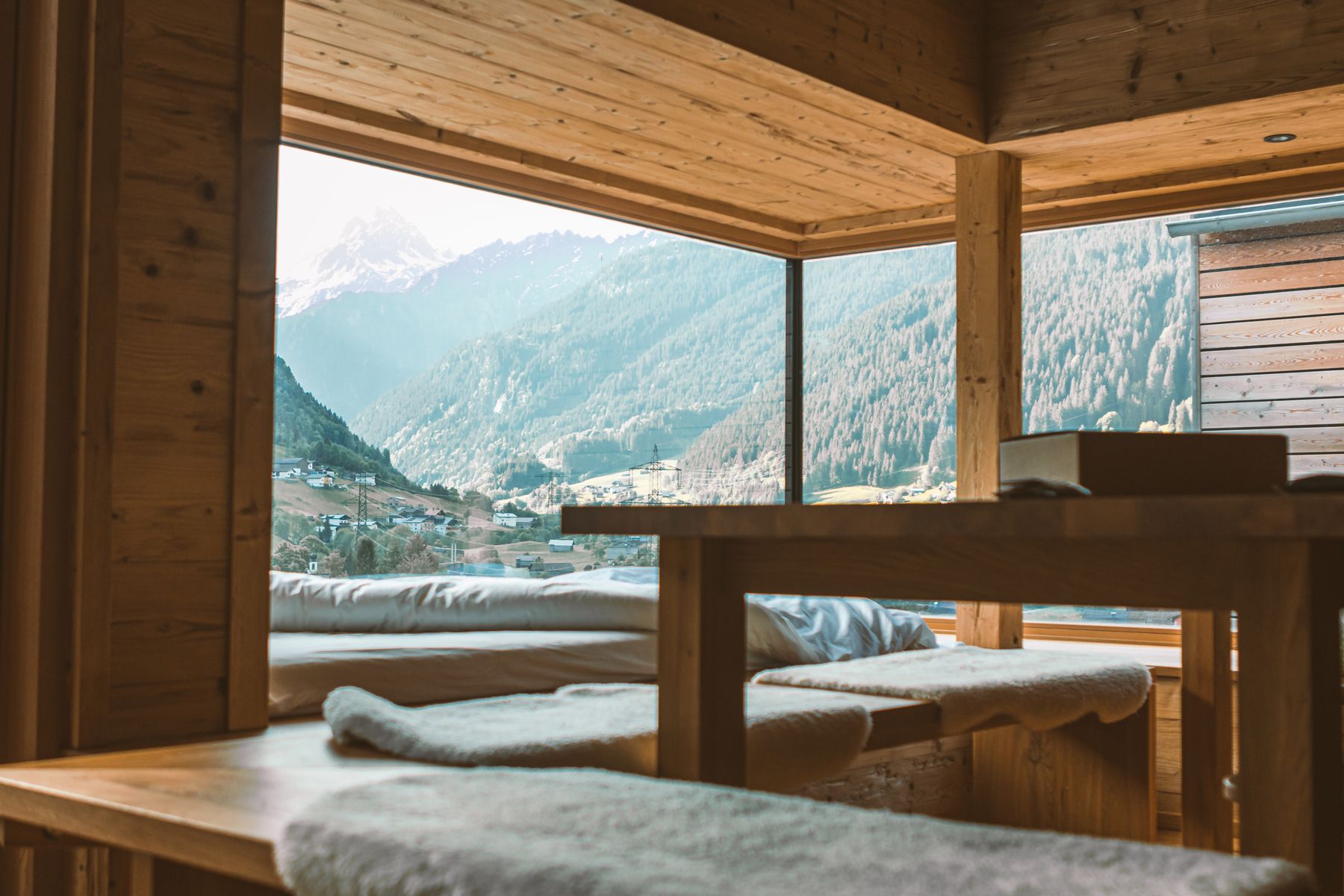 A warm timber interior opening onto mountains