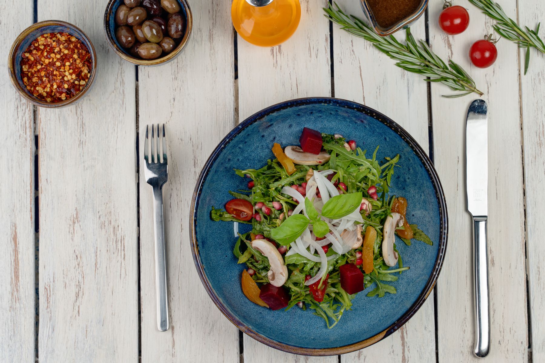 A colourful salad in a blue bowl