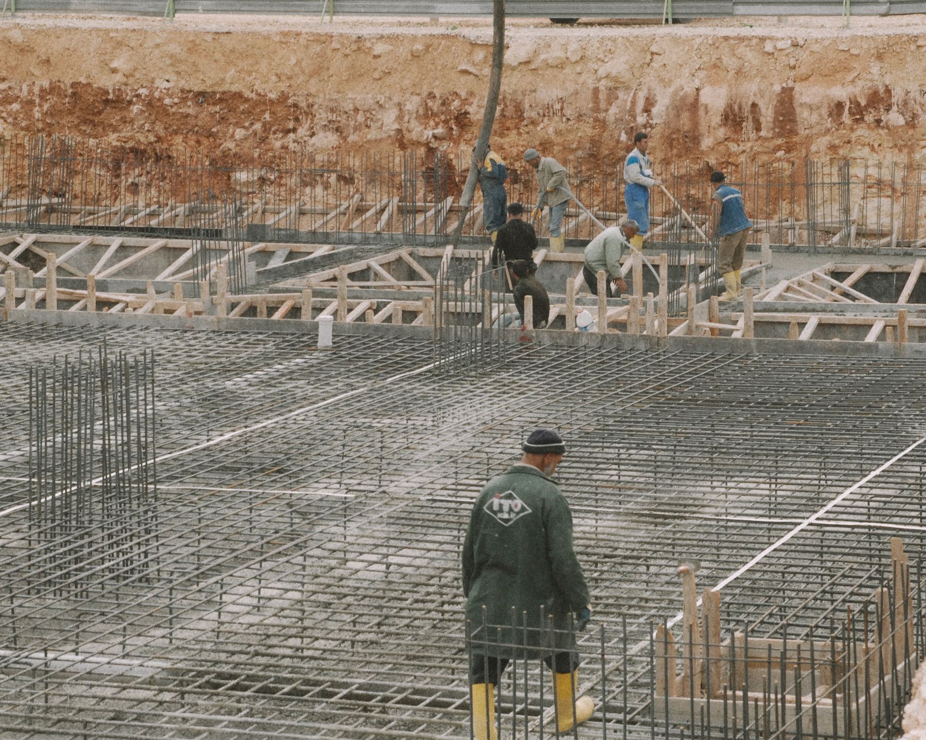 Workers building a rebar foundation