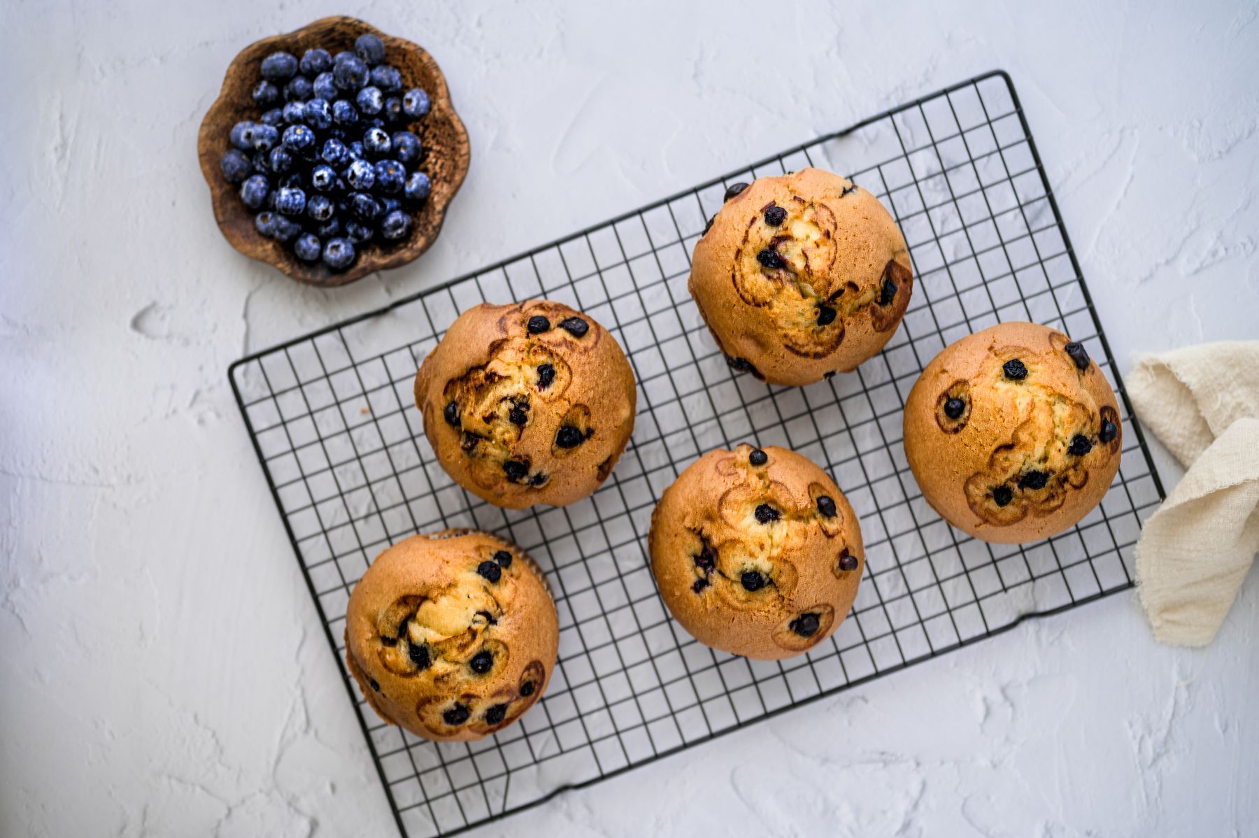 Blueberry muffins on a rack