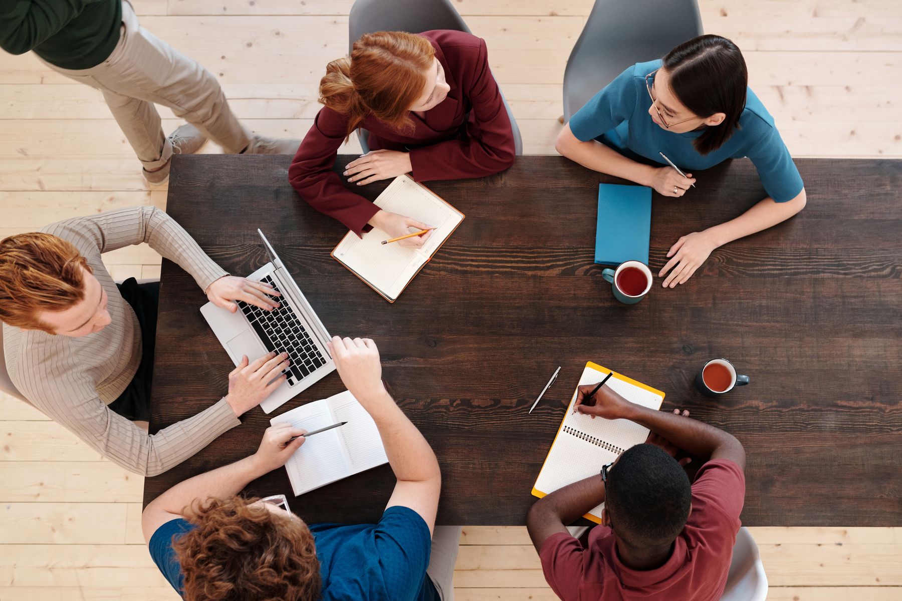 Colleagues collaborating at a wooden table