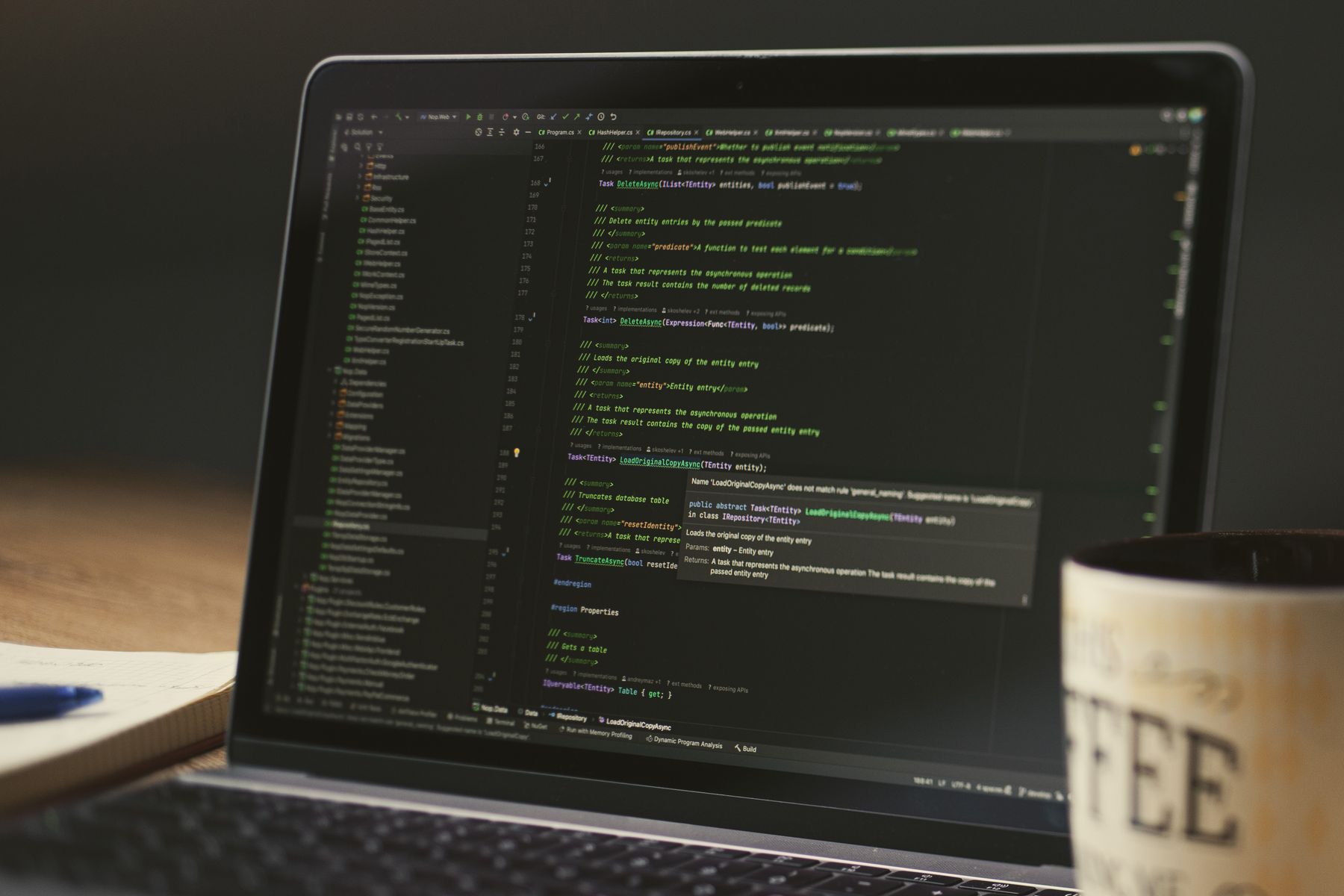 Code on a laptop in a dim room