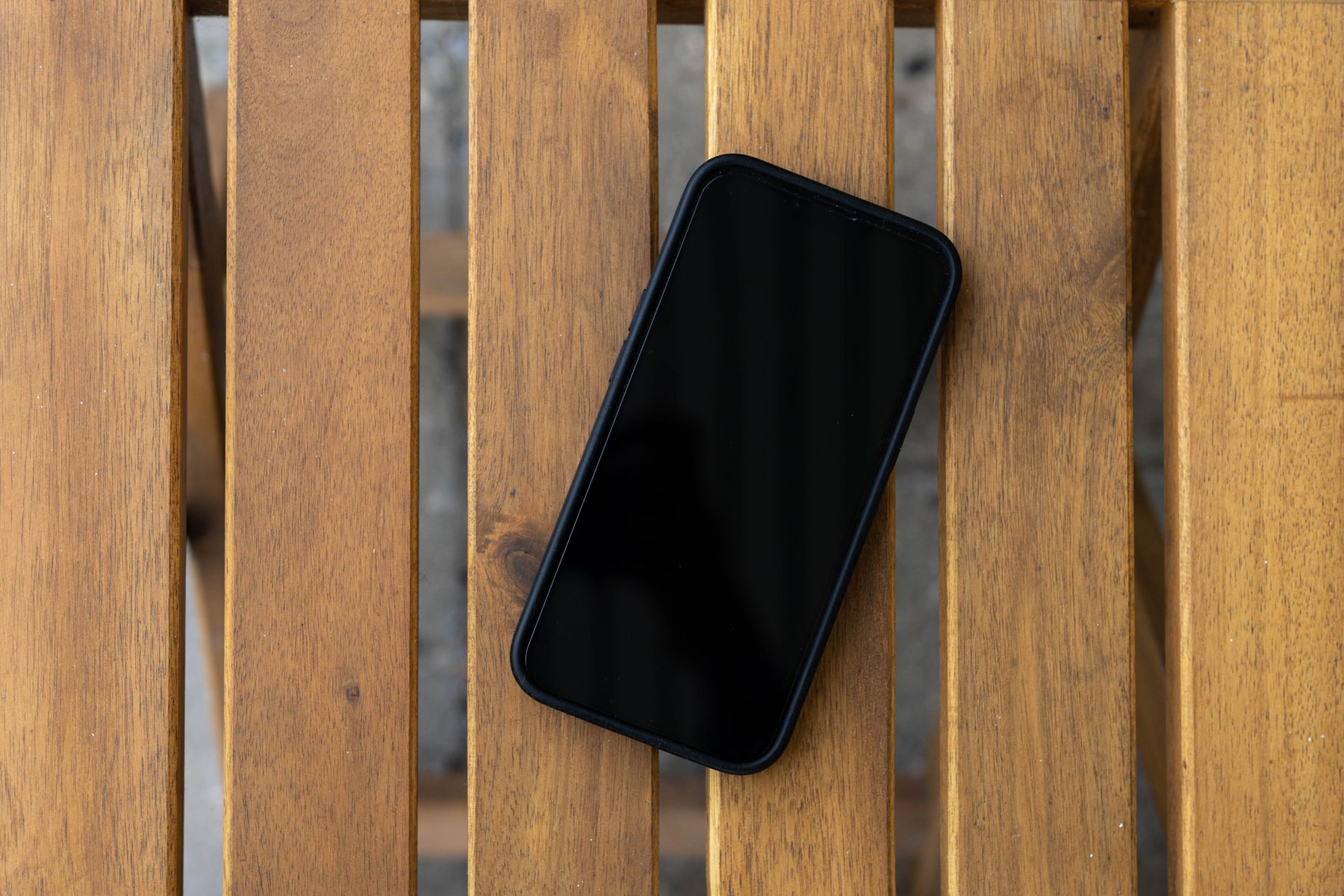 A smartphone on a wooden table