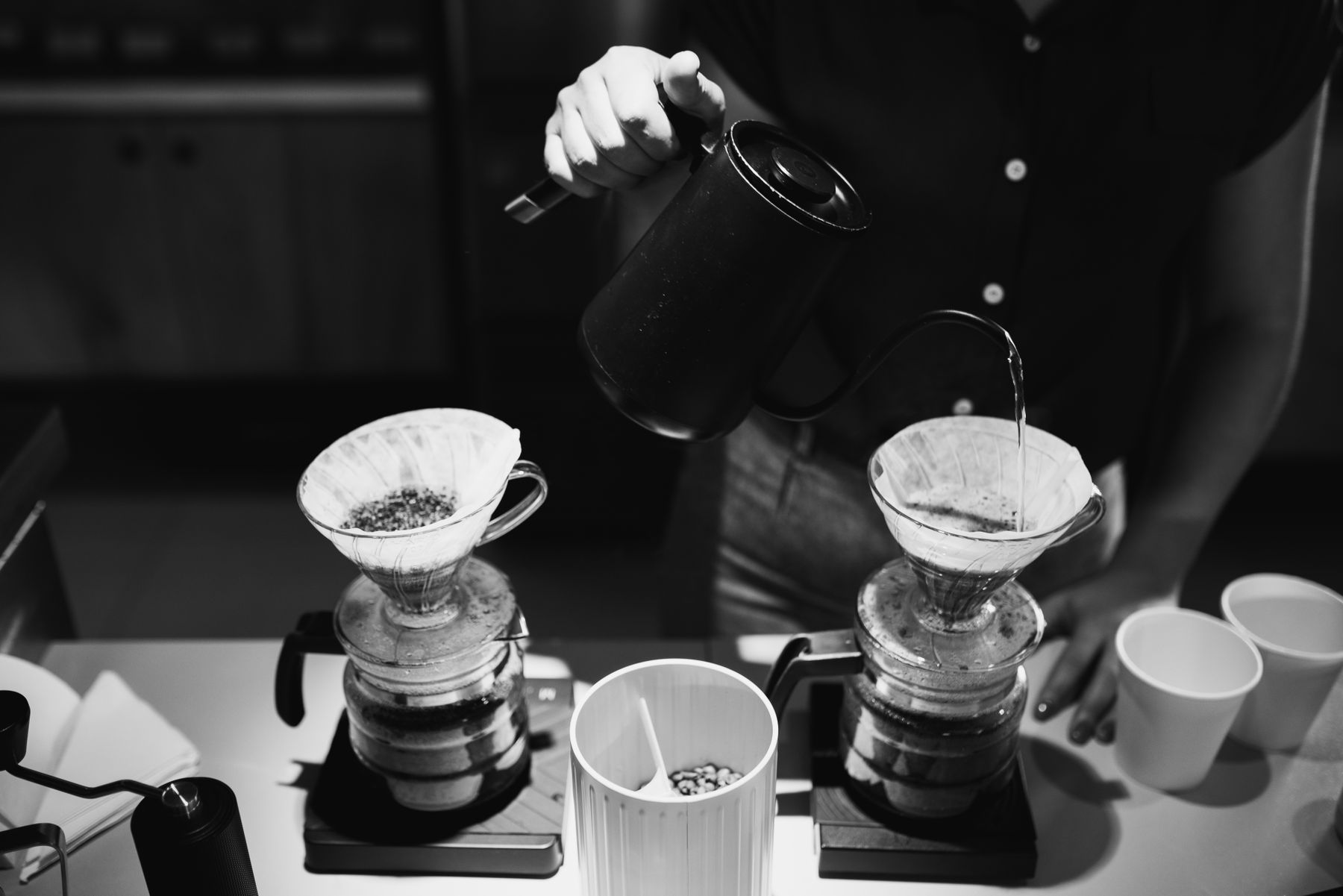 A barista pouring coffee