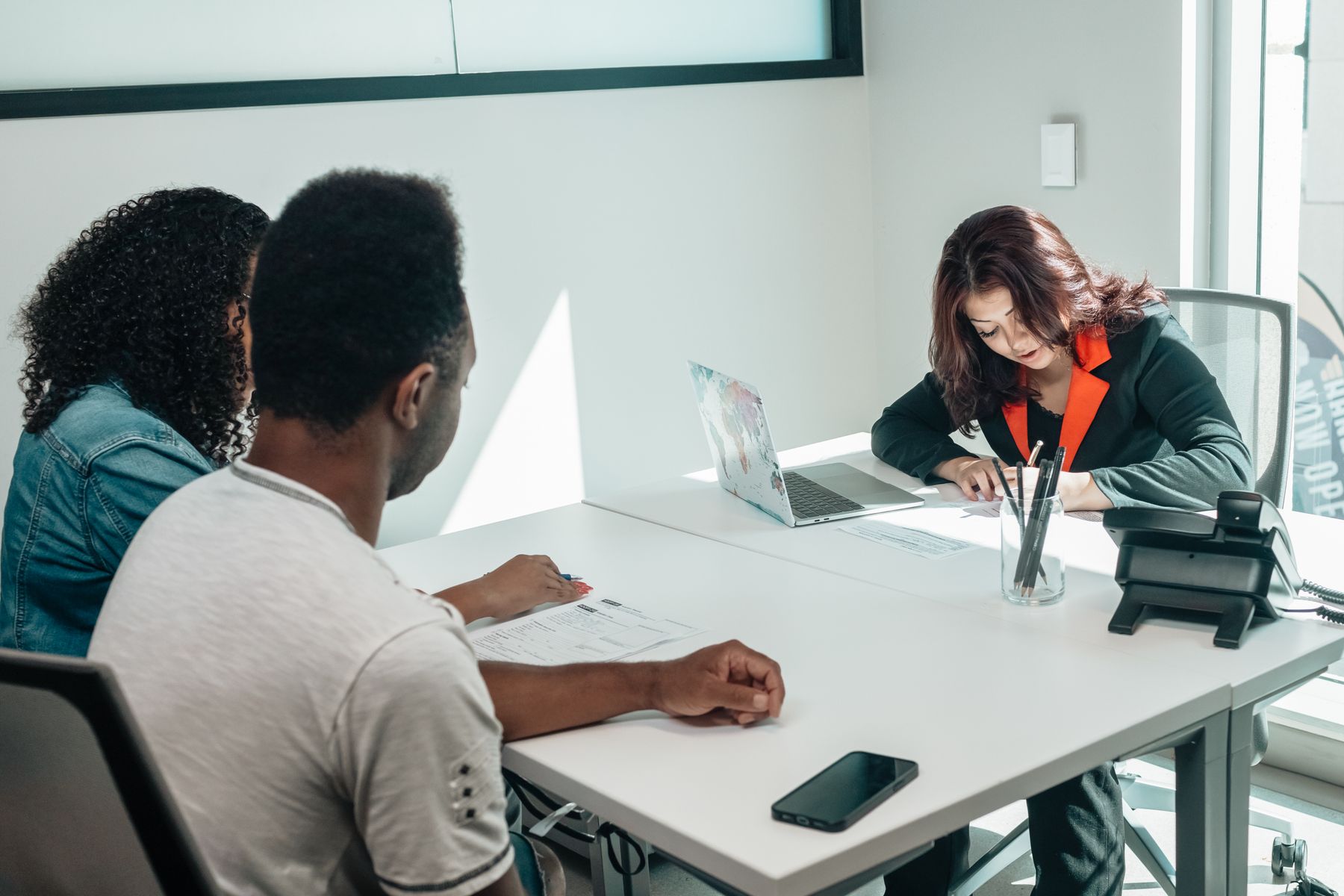 A couple speaking with an adviser