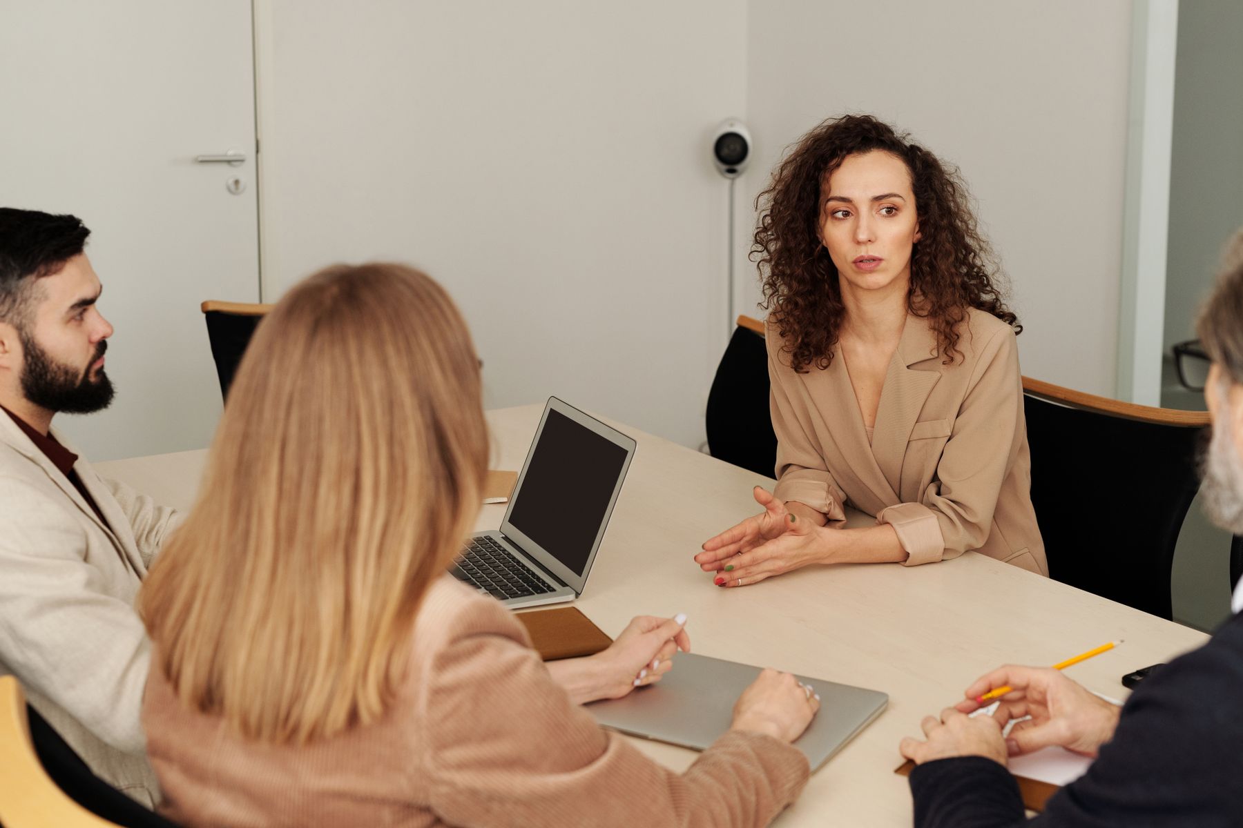 Professionals sharing ideas around a meeting table